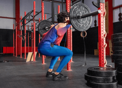 man barbell squatting